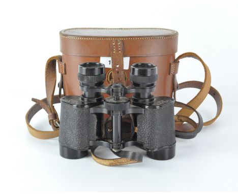 A pair of vintage 8 x 30 binoculars, marked 'Sir John Bennett', within a brown leather case