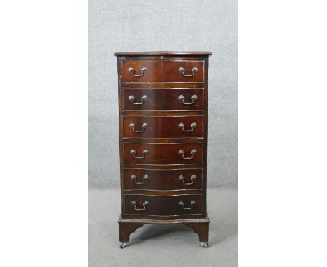 A Georgian style mahogany serpentine fronted tall chest of six drawers on shaped bracket feet. H.100 D.47 W.37CM 