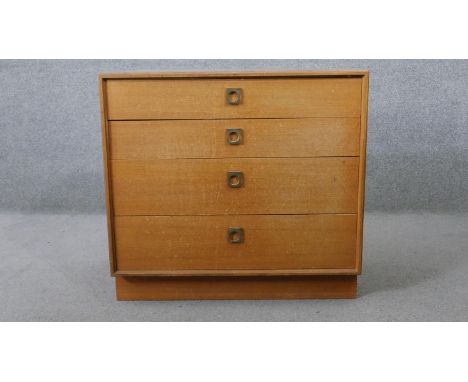 A vintage teak G-Plan chest of four long drawers on plinth base. H.71 W.76 D.44CM 