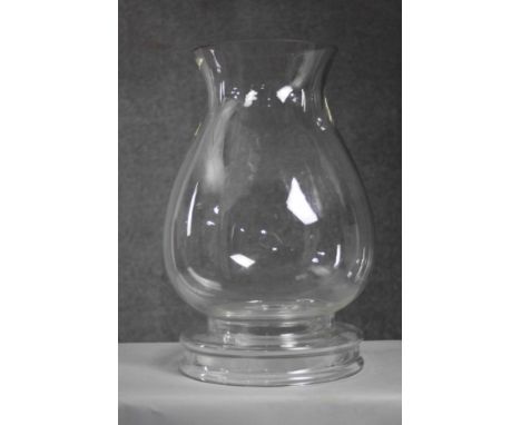 A large contemporary blown clear glass storm lantern with removable base. (2 pieces) H.46 Diameter.27cm. 