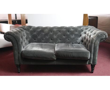 A contemporary Sofa.com Chesterfield sofa in deep buttoned velour upholstery on ring turned tapering supports. H.84 W.180 D.9