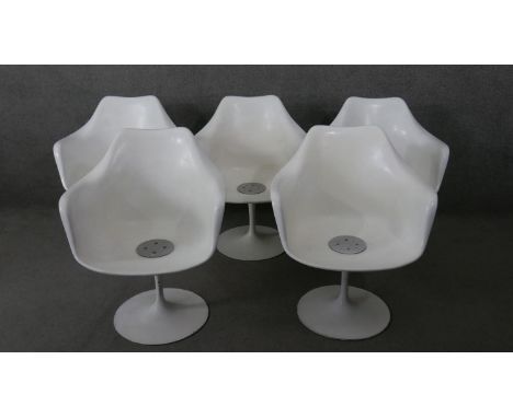 A set of five vintage Eero Saarinen style 'Tulip' dining armchairs with moulded seats on swivel aluminium bases. 