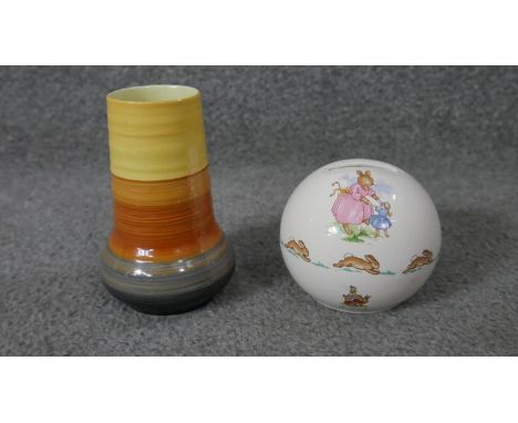 A Shelley hand painted ceramic Art Deco vase along with a Bunnykins Royal Doulton money box. (no plug) H.13 Diam.9cm (largest