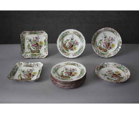 A part Spode peacock design dinner service. Includes nine dinner plates, two serving dishes and three plates. Makers mark to 