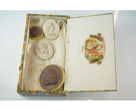 Four "Grand Tour" mementoes, comprising; an oval plaster portrait medallion inscribed "A Pope", another with a classical prof