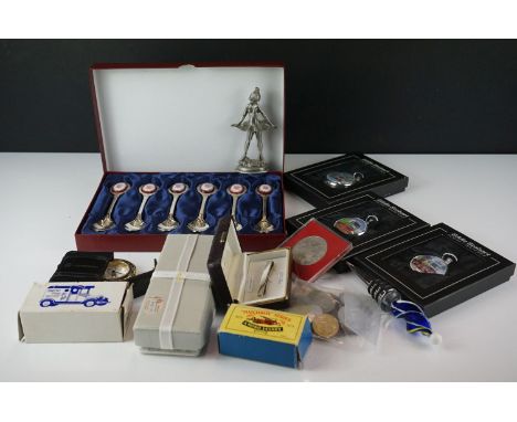 A box of mixed collectables to include Eddie Stobart pocket watches, coins, die cast vehicles....etc. 