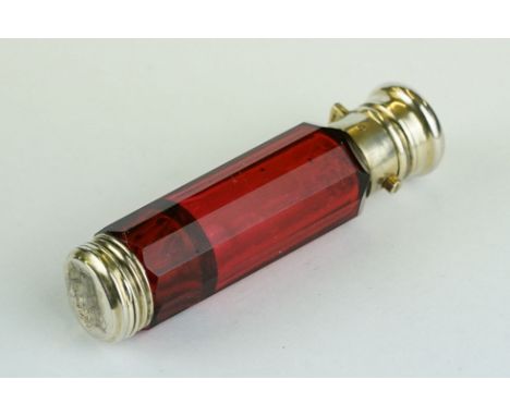 19th century double ended ruby glass scent bottle, the plain polished white metal cap opening with press catch to reveal scen