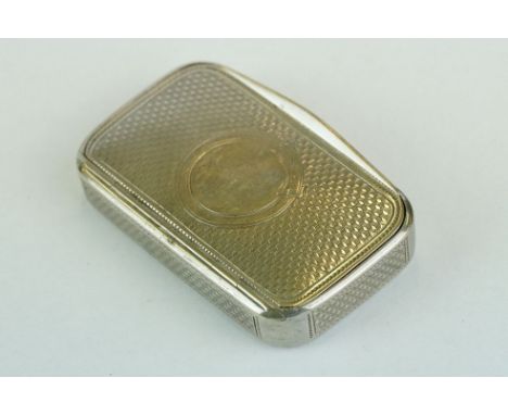 Continental silver snuff box, gilt lined interior, vacant circular cartouche with engraved buckle detailing to the hinged lid