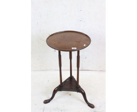 Early 19th century Mahogany Circular Lamp / Wine Table, the tray top  raised on three slender supports united by an under-tie