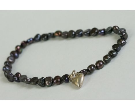 A blister pearl bracelet with silver heart shaped clasp 