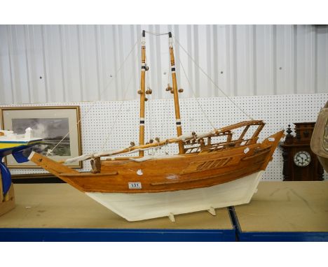 Scratch-built painted wooden model of a sailing ship, with two masts, sails and rigging details, approx 90cm long 
