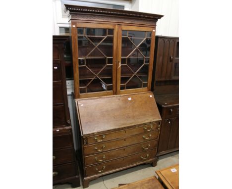 George III Mahogany Bureau Bookcase, the upper section with two astragel glazed doors, over a sloping fall front opening to a
