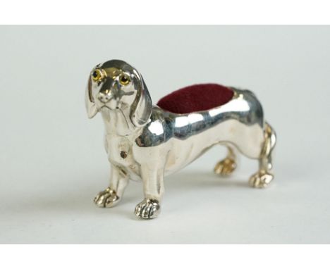 A silver dachshund dog pin cushion 
