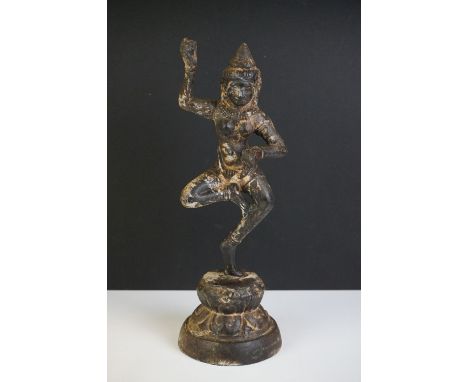 Cast Iron Indian model of a dancing Hindu figure, on a circular base, 31cm high 