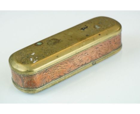 An antique 18th century brass and copper snuff box with ornate chased decoration. 