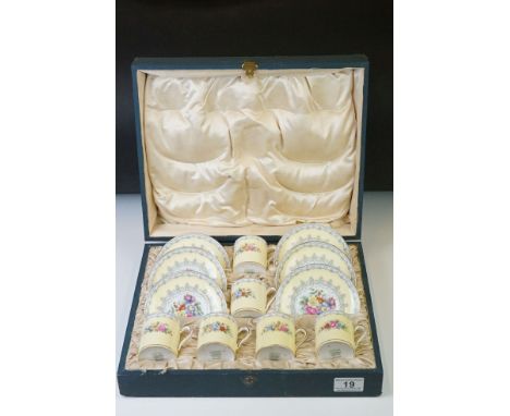 Shelley Boxed Yellow ' Crochet' pattern coffee set, to include six coffee cans and saucers, with floral decoration 