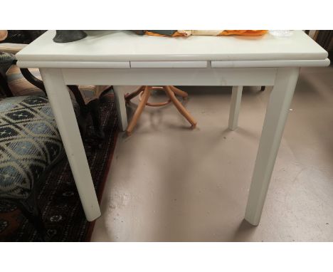 A white laminate draw leaf kitchen table and 4 ladder back chairs 