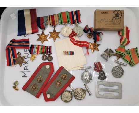 A WWII group of 4 medals together with a Territoral Army Nursing Service cape badge attributed to N/O Gladys Rider, Liverpool