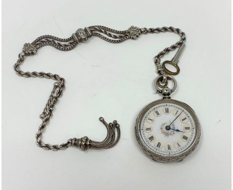 A hallmarked silver pocket watch having white enamel dial with central floral decoration and an ornate rope twist Albert with