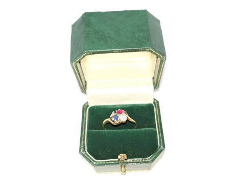 A late 19th Century, early 20th Century gold ring with three stone cluster setting of 2 diamonds, a sapphire and a ruby on ye