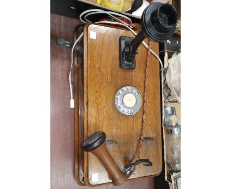 An early 20th century telephone, wall hanging stick type 