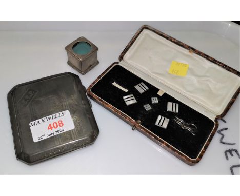 A hallmarked silver engine turned cigarette case, monogrammed, weighted, Birmingham 1924; an Art Deco style cufflink set, box