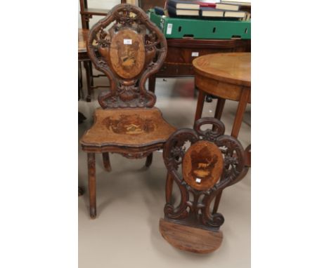 A carved "Black Forest" hall chair with Tyrolean scene marquetry panels to the seat and back and a similar wall shelf 