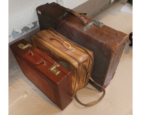 A vintage suitcase ; a tan leather overnight bag; a crocodile effect briefcase 