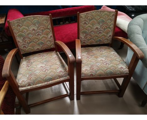 A pair of 1930's oak framed open armchair in patterned tapestry fabric 
