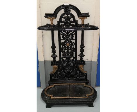 A black and gilt painted cast iron stick stand 