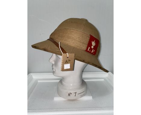 Lancashire Fusiliers, a tropical pith helmet,  red cloth badge, c. 1920's and stand 