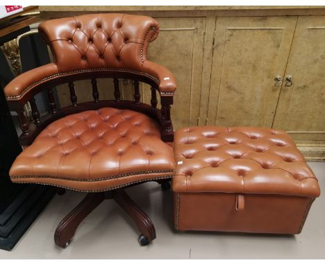 A swivel armchair and stool in button tan hide 