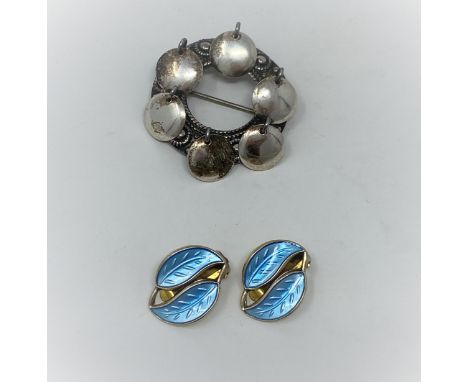 A pair of double leaf clip-on earrings in gilded sterling silver and turquoise enamel by David Anderson, designed by W Winnae