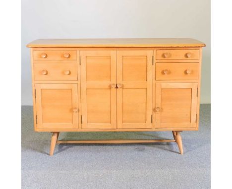 A rare 1960's Ercol light elm sideboard, fitted with an arrangement of drawers and cupboards, on a splayed base130w x 50d x 8