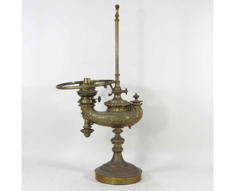 A 19th century brass adjustable oil lamp, in the form of an Aladdin's lamp, with relief decoration, 60cm highOverall dirty an