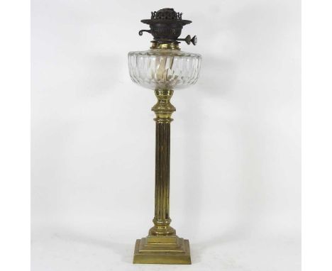 A 19th century brass oil lamp, in the form of a column, with a facet cut clear glass font, 56cm highOverall condition is comp