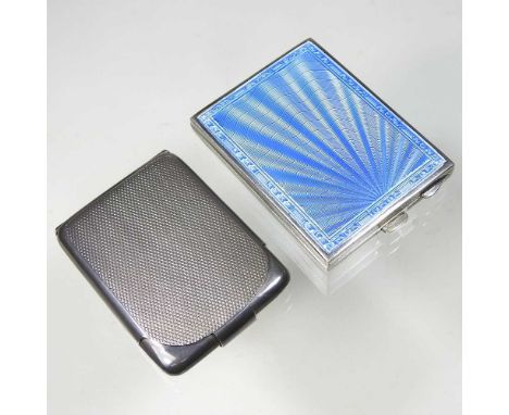 An Art Deco silver compact, the hinged case with a blue guilloche enamel sunburst, the interior with a mirror, Birmingham 193