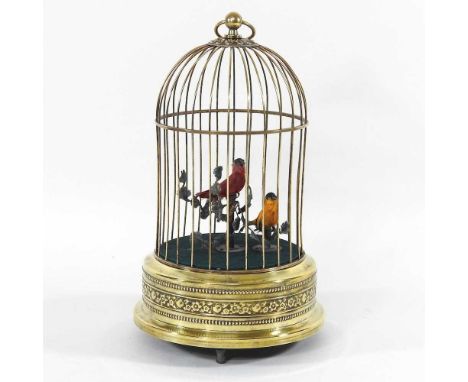 A clockwork automaton birdcage, with a songbird, 27cm highIt moves and sings when wound. Some light signs of age and use. No 