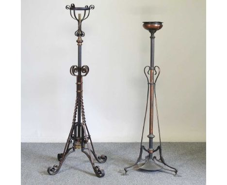 An early 20th century wrought iron telescopic standard lamp, 138cm high, together with an Arts and Crafts brass lamp base, on