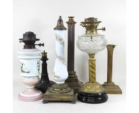 A collection of six various oil lamp bases, to include a brass Hink's Corinthian column lamp, 46cm high (6)