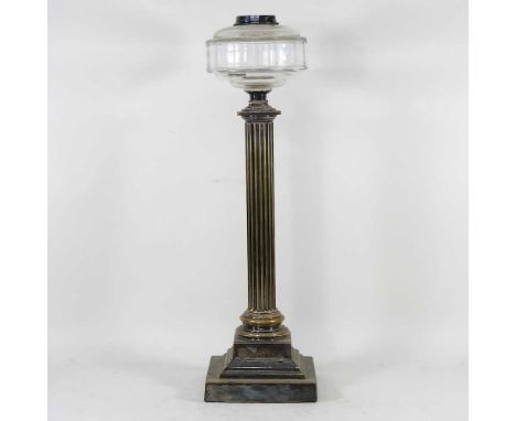 A 19th century brass oil lamp, on fluted column form, with a facet cut font, 57cm high