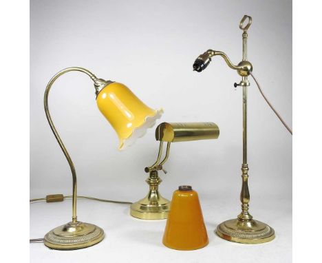 A brass adjustable desk lamp, 33cm high, together with two others (3)