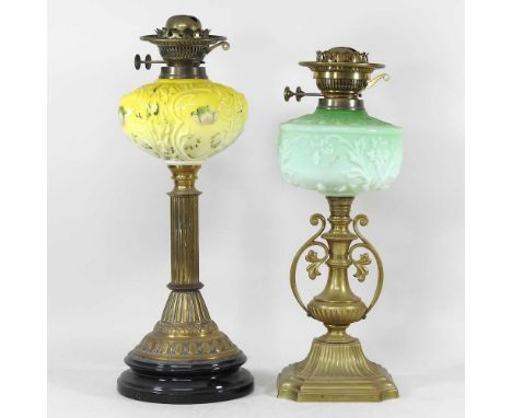 A 19th century brass oil lamp, with a yellow opaline glass font, 50cm high, together with another green (2)