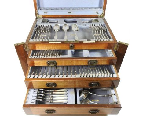 An early 20th century part canteen of silver plated cutlery, in a fitted canteen with a hinged lid over three drawers, by Gol