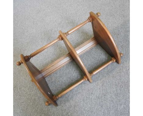 An Ercol three tier hanging corner shelf, 34 x 79cm
