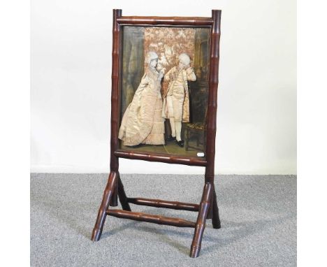 A 19th century trompe l'oeil bamboo firescreen, inset with an 18th century style French lady and her companion, on a splayed 