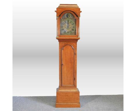 An 18th century oak cased longcase clock, the twelve inch arched brass dial signed Nat Hedge, Colchester, with tempus fugit s