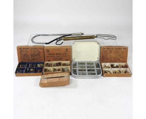 A collection of early 20th century Hardy fishing flies, to include box for The Halfords Pattern 1904, together with a cork pe