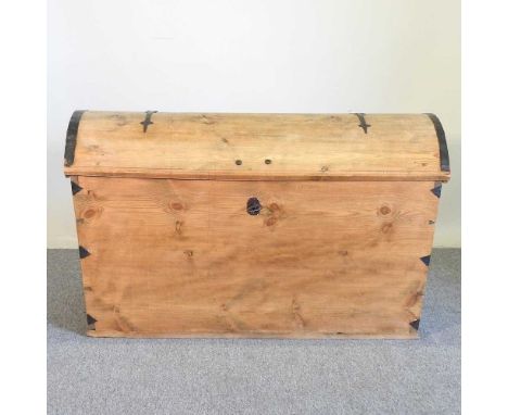 A large antique pine dome top trunk, with a hinged lid, flanked by carrying handles123w x 60d x 73h cm