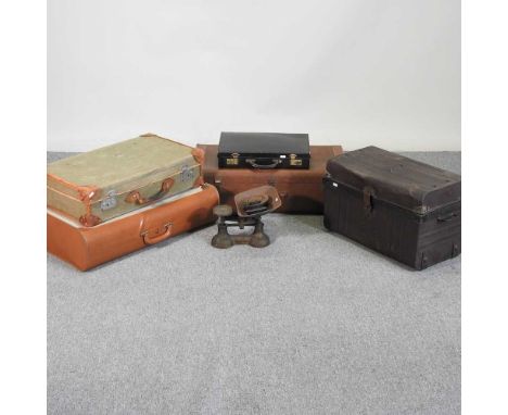 A collection of vintage cases, largest 73 x 54cm, together with a tin trunk and a set of cast iron scales